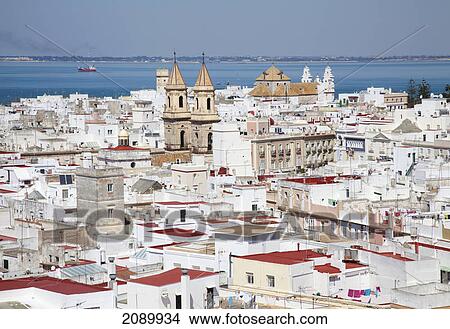 Whitewashed buildings in a town along the coast; cadiz, andalusia, spain View Large Photo Image Picture - Whitewashed buildings in a town along the coast; cadiz, andalusia, spain. Fotosearch