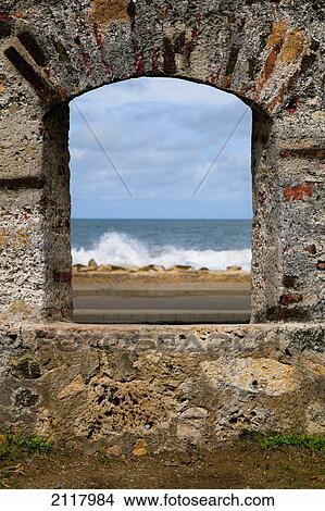 Picture - Window looks through cartagena city wall to cartagena bay; cartagena colombia. Fotosearch