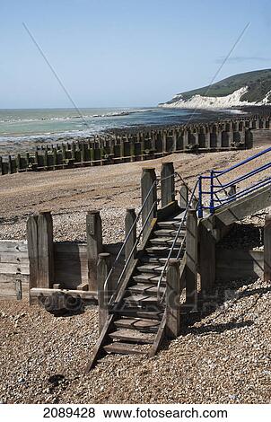 Wooden steps, groynes and pebble beach; sussex, england View Large Photo Image Stock Photo - Wooden steps, groynes and pebble beach; sussex, england. Fotosearch