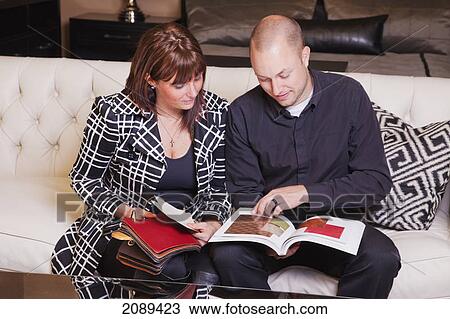 Young couple shopping for furniture in retail furniture store; edmonton, alberta, canada View Large Photo Image Stock Image - Young couple shopping for furniture in retail furniture store; edmonton, alberta, canada. Fotosearch
