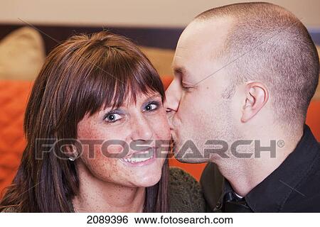 Stock Photograph - Young married couple in love spending quality time together; edmonton, alberta, canada. Fotosearch