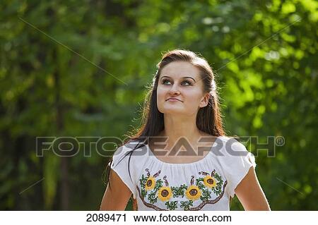 Young woman walking in a park; edmonton, alberta, canada View Large Photo Image Stock Image - Young woman walking in a park; edmonton, alberta, canada. Fotosearch