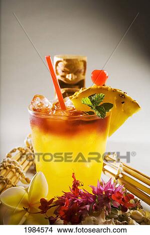 Picture - A Mai Tai Garnished With Pinapple And A Cherry.. Fotosearch
