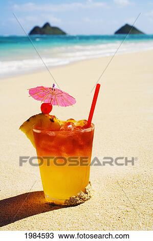 A Mai Tai Garnished With Pinapple And A Cherry, Sitting In The Sand On The Beach. View Large Photo Image Stock Image - A Mai Tai Garnished With Pinapple And A Cherry, Sitting In The Sand On The Beach.. Fotosearch