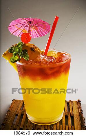 A Mai Tai Garnished With Pinapple And A Cherry. View Large Photo Image Stock Photo - A Mai Tai Garnished With Pinapple And A Cherry.. Fotosearch