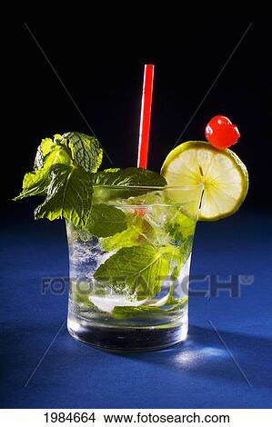 A Mojito Garnished With Fruit And Mint. View Large Photo Image Picture - A Mojito Garnished With Fruit And Mint.. Fotosearch