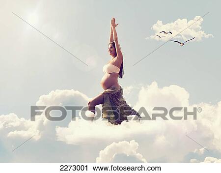 A pregnant woman doing a yoga pose in the clouds; tarifa cadiz andalusia spain View Large Photo Image Stock Image - A pregnant woman doing a yoga pose in the clouds; tarifa cadiz andalusia spain. Fotosearch