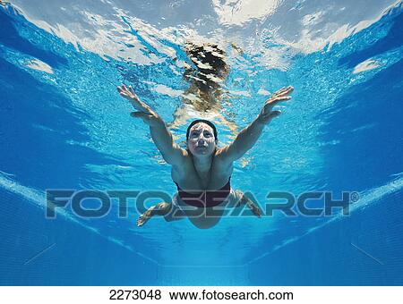 A pregnant woman swimming underwater; tarifa cadiz andalusia spain View Large Photo Image Stock Photo - A pregnant woman swimming underwater; tarifa cadiz andalusia spain. Fotosearch