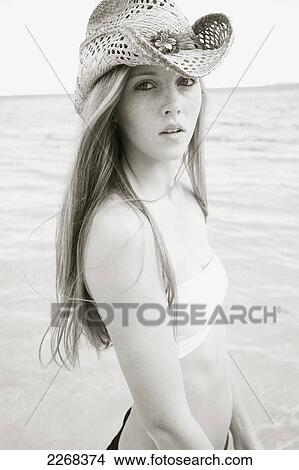A young woman posing by the ocean; kauai hawaii united states of america View Large Photo Image Picture - A young woman posing by the ocean; kauai hawaii united states of america. Fotosearch