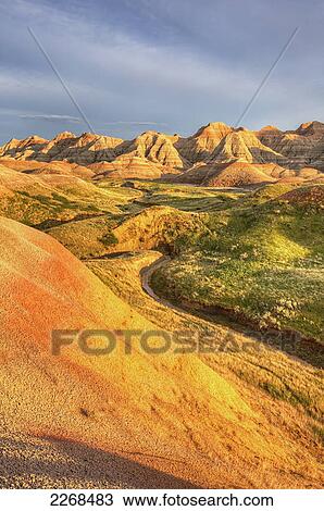 Afternoon sunshine hits the yellow mounds region in badlands national park; south dakota united states of america View Large Photo Image Stock Image - Afternoon sunshine hits the yellow mounds region in badlands national park; south dakota united states of america. Fotosearch
