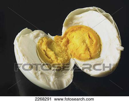 An open egg on a black background View Large Photo Image Stock Image - An open egg on a black background. Fotosearch