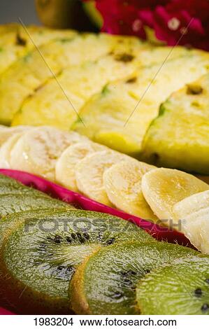 Close-Up Of Kiwi, Banana And Pineapple Slices. View Large Photo Image Picture - Close-Up Of Kiwi, Banana And Pineapple Slices.. Fotosearch