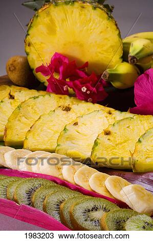 Stock Image - Close-Up Of Kiwi, Banana And Pineapple Slices.. Fotosearch