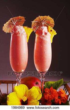 Stock Photo - Close-Up Of Two Glasses Filled With A Creamy Pink Tropical Drink.. Fotosearch