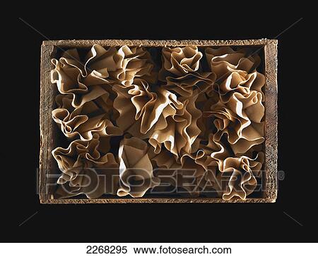 Stock Photography - Coffee filters in a wooden crate. Fotosearch