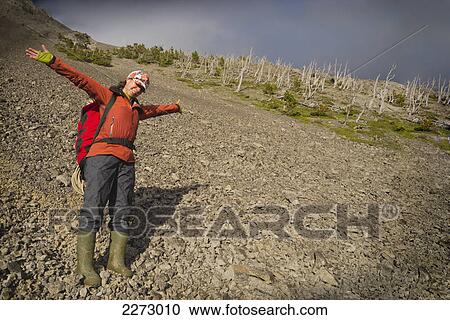 Female caver celebrating on a mountainside; coleman alberta canada View Large Photo Image Stock Image - Female caver celebrating on a mountainside; coleman alberta canada. Fotosearch