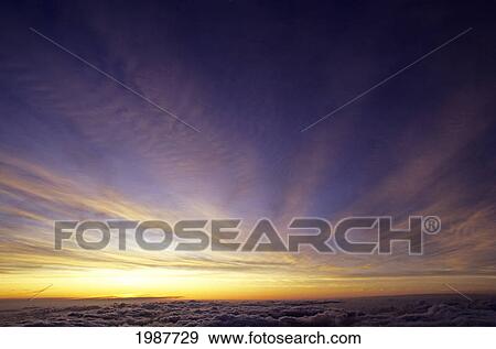 Stock Photo - Hawaii, Incredible Sunset Sky Above Clouds, View From Air. Fotosearch