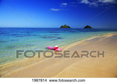 Picture - Hawaii, Oahu, Lanikai, Pink Inflated Raft And Beachball On Clear Ocean Water, Mokulua's In Background.. Fotosearch