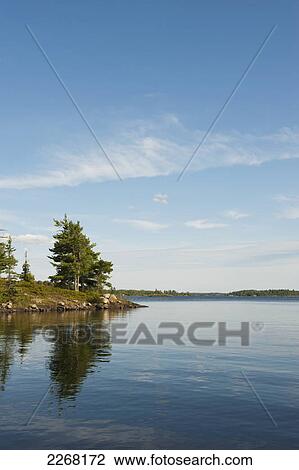 Lake view with trees in lake of the woods; kenora ontario canada View Large Photo Image Stock Image - Lake view with trees in lake of the woods; kenora ontario canada. Fotosearch
