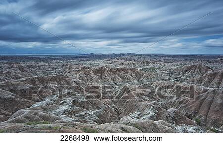 Long exposure of clouds overtop of badlands national park; south dakota united states of america View Large Photo Image Stock Photo - Long exposure of clouds overtop of badlands national park; south dakota united states of america. Fotosearch