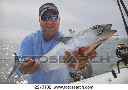 Man holding false albacore tuna; montauk new york united states of america View Large Photo Image Stock Image - Man holding false albacore tuna; montauk new york united states of america. Fotosearch