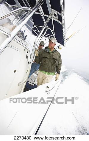 Men on boat off the coast of massachusetts; united states of america View Large Photo Image Stock Image - Men on boat off the coast of massachusetts; united states of america. Fotosearch
