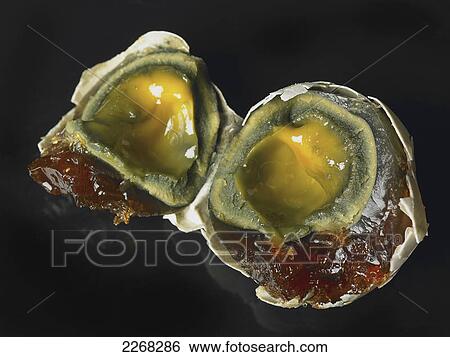 Open eggs on a black background View Large Photo Image Stock Photograph - Open eggs on a black background. Fotosearch