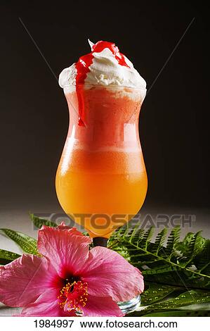 Orange And Pink Tropical Drink Topped With Whip Cream, Dripping With Strawberry Syrup. View Large Photo Image Stock Photo - Orange And Pink Tropical Drink Topped With Whip Cream, Dripping With Strawberry Syrup.. Fotosearch