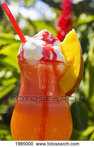 Orange Tropical Drink Topped With Whip Cream, Dripping With Strawberry Syrup. View Large Photo Image Stock Image - Orange Tropical Drink Topped With Whip Cream, Dripping With Strawberry Syrup.. Fotosearch