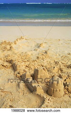 Partially Built Sandcastle On A Tropical Beach. View Large Photo Image Stock Photo - Partially Built Sandcastle On A Tropical Beach.. Fotosearch