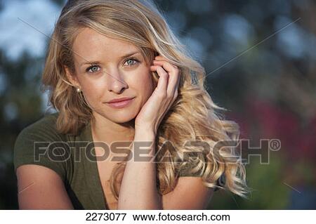 Portrait of a woman with long blond hair; arvada colorado united states of america View Large Photo Image Stock Photo - Portrait of a woman with long blond hair; arvada colorado united states of america. Fotosearch