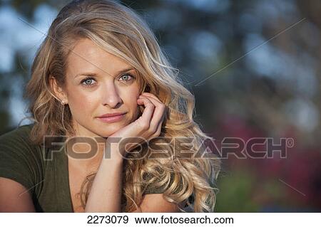 Portrait of a woman with long blond hair; arvada colorado united states of america View Large Photo Image Stock Photo - Portrait of a woman with long blond hair; arvada colorado united states of america. Fotosearch