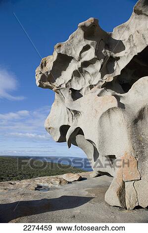 Stock Photo - Rock eroded into a unique shaped surface by the coast; australia. Fotosearch