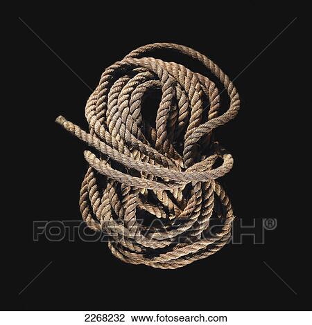 Rope tied up on a black background View Large Photo Image Stock Image - Rope tied up on a black background. Fotosearch