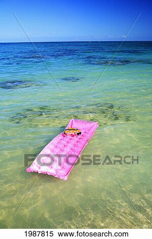 Snorkel And Mask Rest On Pink Inflated Raft Afloat On Clear Ocean Water. View Large Photo Image Stock Photography - Snorkel And Mask Rest On Pink Inflated Raft Afloat On Clear Ocean Water.. Fotosearch