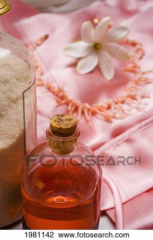 Spa Elements, Bottle Of Pink Bath Gel, Flower And Necklace On Pink Cloth Blurred In Background. View Large Photo Image Stock Image - Spa Elements, Bottle Of Pink Bath Gel, Flower And Necklace On Pink Cloth Blurred In Background.. Fotosearch