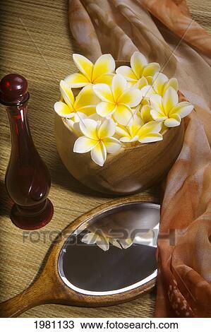 Spa Elements, Bright Yellow Plumerias In A Koa Bowl, Hand Mirror, Scarf, Lauhala Mat And Glass Bottle. View Large Photo Image Stock Image - Spa Elements, Bright Yellow Plumerias In A Koa Bowl, Hand Mirror, Scarf, Lauhala Mat And Glass Bottle.. Fotosearch
