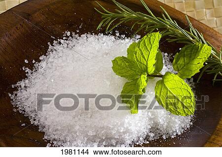 Picture - Spa Elements, Koa Bowl Filled With Raw Salt, Garnished With A Sprig Of Mint And Rosemary.. Fotosearch