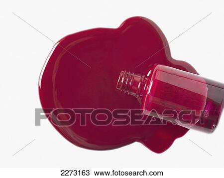 Spilled red nail polish and bottle on a white background View Large Photo Image Stock Image - Spilled red nail polish and bottle on a white background. Fotosearch