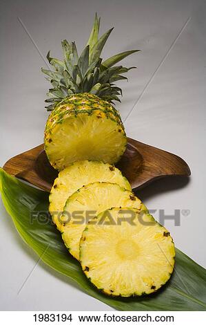 Studio Shot Of A Pineapple, Cut Into Slices. View Large Photo Image Picture - Studio Shot Of A Pineapple, Cut Into Slices.. Fotosearch