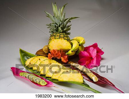 Stock Image - Studio Shot Of A Pineapple, Kiwi And Bananas, Cut Into Slices.. Fotosearch
