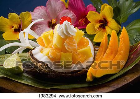 Picture - Studio Shot Of A Tropical Fruit Salad With Flowers.. Fotosearch