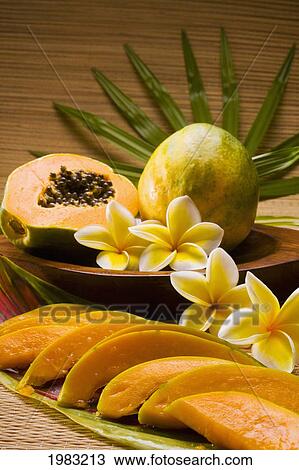 Studio Shot Of Papaya, Whole And In Slices With Flowers. View Large Photo Image Stock Image - Studio Shot Of Papaya, Whole And In Slices With Flowers.. Fotosearch