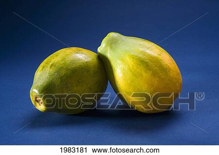 Stock Image - Studio Shot Of Two Papayas.. Fotosearch