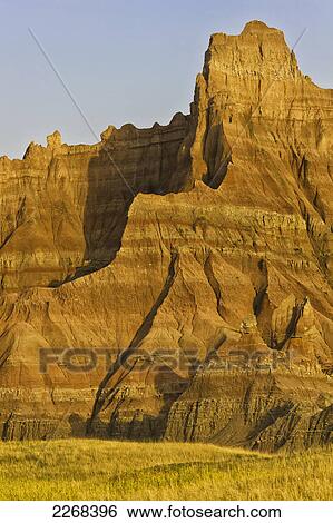 Sunrise lights up a large formation of badlands national park; south dakota united states of america View Large Photo Image Stock Photograph - Sunrise lights up a large formation of badlands national park; south dakota united states of america. Fotosearch