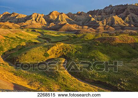 The area called yellow mounds lit by the sunset in badlands national park; south dakota united states of america View Large Photo Image Stock Photography - The area called yellow mounds lit by the sunset in badlands national park; south dakota united states of america. Fotosearch