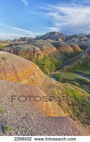 Stock Image - The yellow mounds area at sunset in badlands national park; south dakota united states of america. Fotosearch