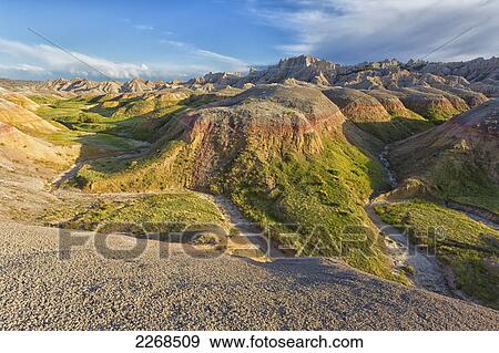 Stock Photo - The yellow mounds area at sunset in badlands national park; south dakota united states of america. Fotosearch