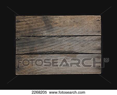 Stock Photography - Three wooden boards nailed in a row on a black background. Fotosearch