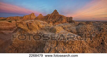 Stock Photo - Twilight over the hoodoos and rock formations in badlands national park; south dakota united states of america. Fotosearch
